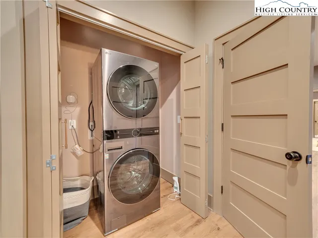 a view of a hallway with washer and dryer