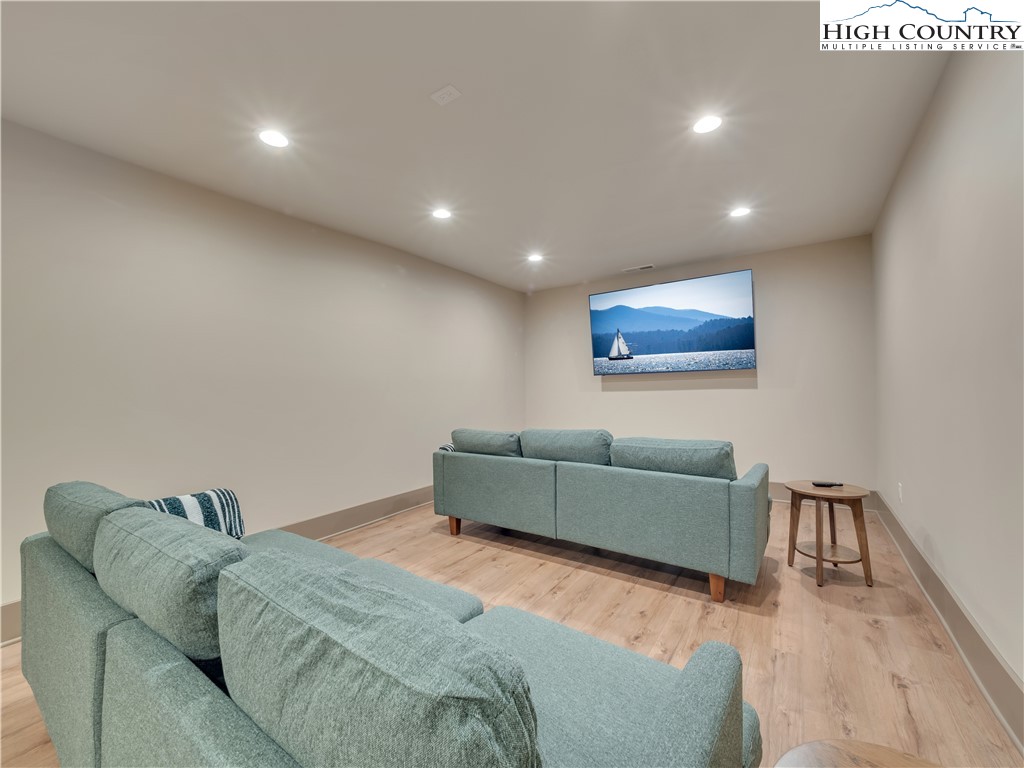 216 Greenbriar Road Beech Mountain, NC 28604 - Photo 43 of 50 a living room with furniture and a wooden floor