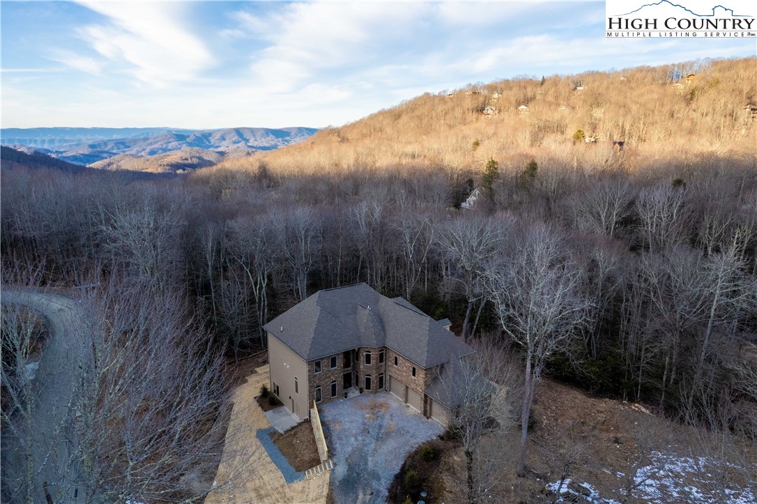 216 Greenbriar Road Beech Mountain, NC 28604 - Photo 45 of 50 a view of a table and chairs under an umbrella