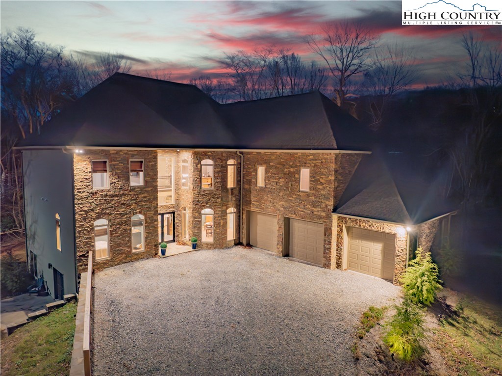 216 Greenbriar Road Beech Mountain, NC 28604 - Photo 49 of 50 a view of a house with a yard
