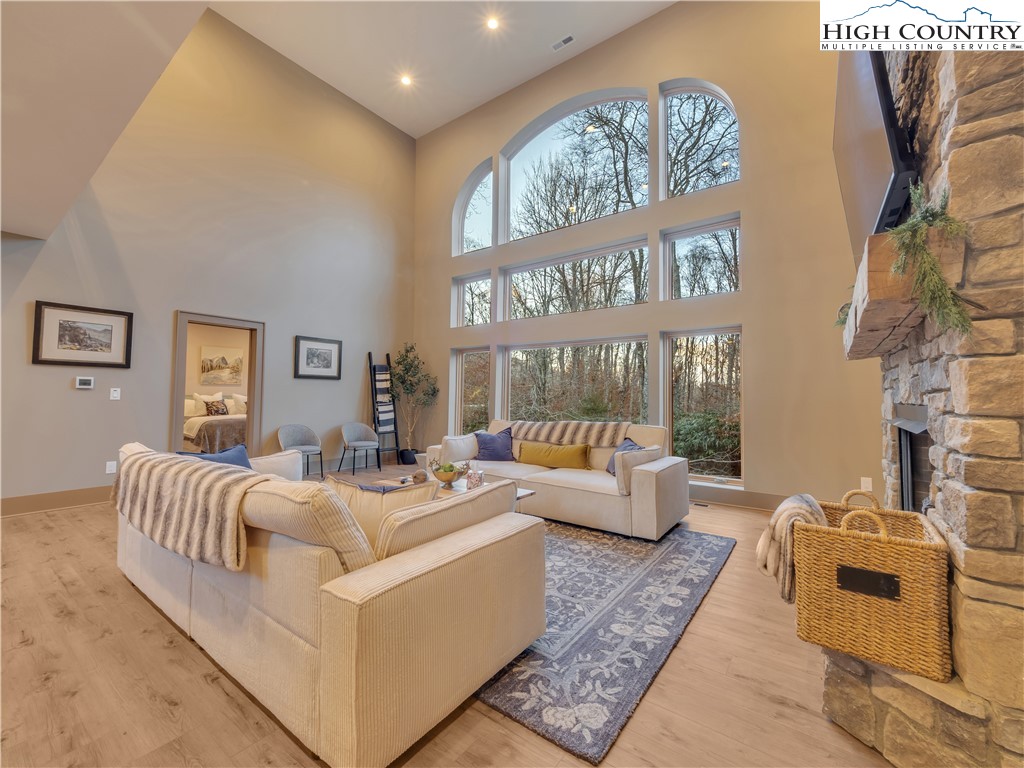 216 Greenbriar Road Beech Mountain, NC 28604 - Photo 5 of 50 a living room with furniture and a large window