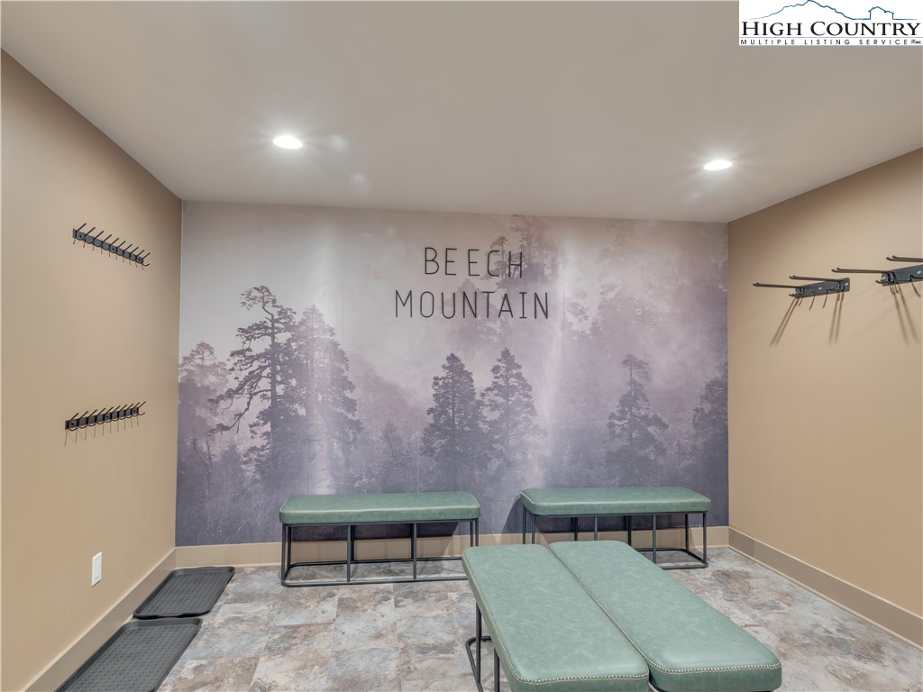 216 Greenbriar Road Beech Mountain, NC 28604 - Photo 6 of 50 a bedroom with a window and a table