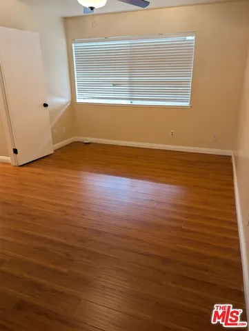 a view of room and wooden floor