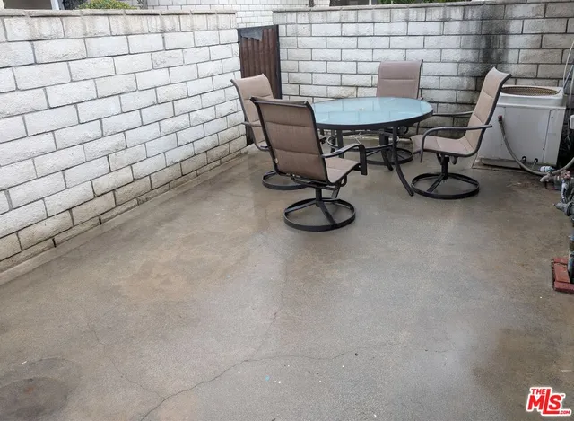 a view of a room with table and chair