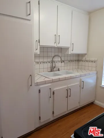 a view of a kitchen with cabinets