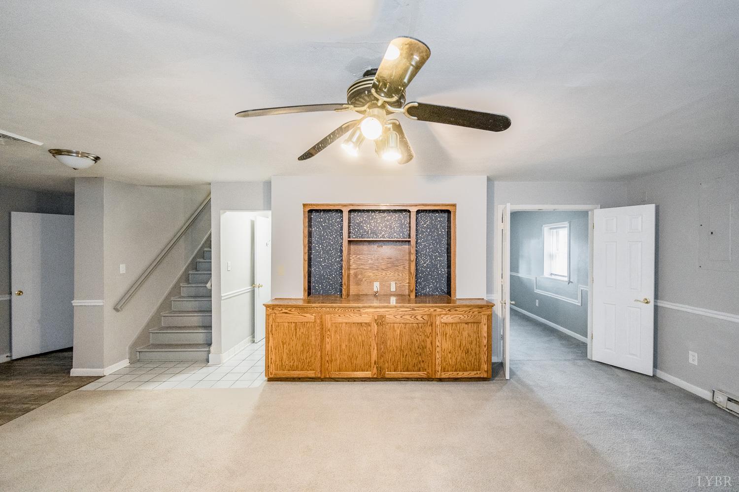 4925 Old Boonsboro Road Lynchburg, VA 24503 - Photo 36 of 57 a living room with furniture and a ceiling fan