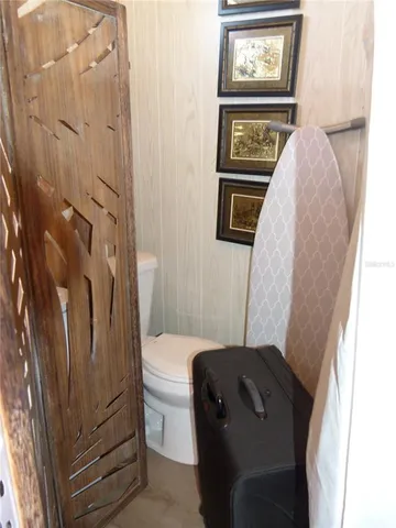 a bathroom with a toilet a sink and bathtub