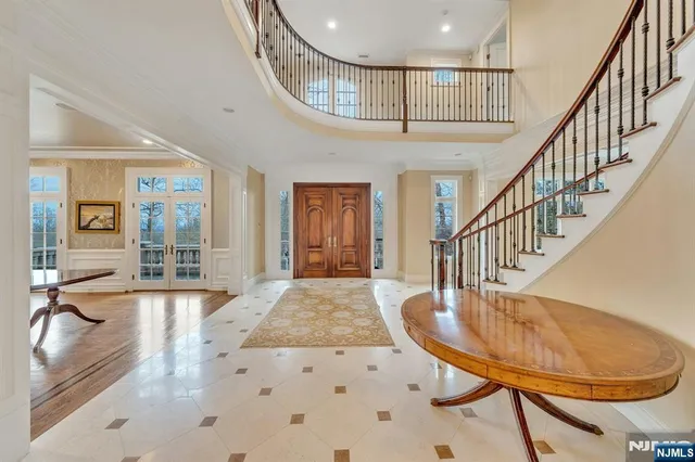 a view of a livingroom with furniture staircase and a dining room