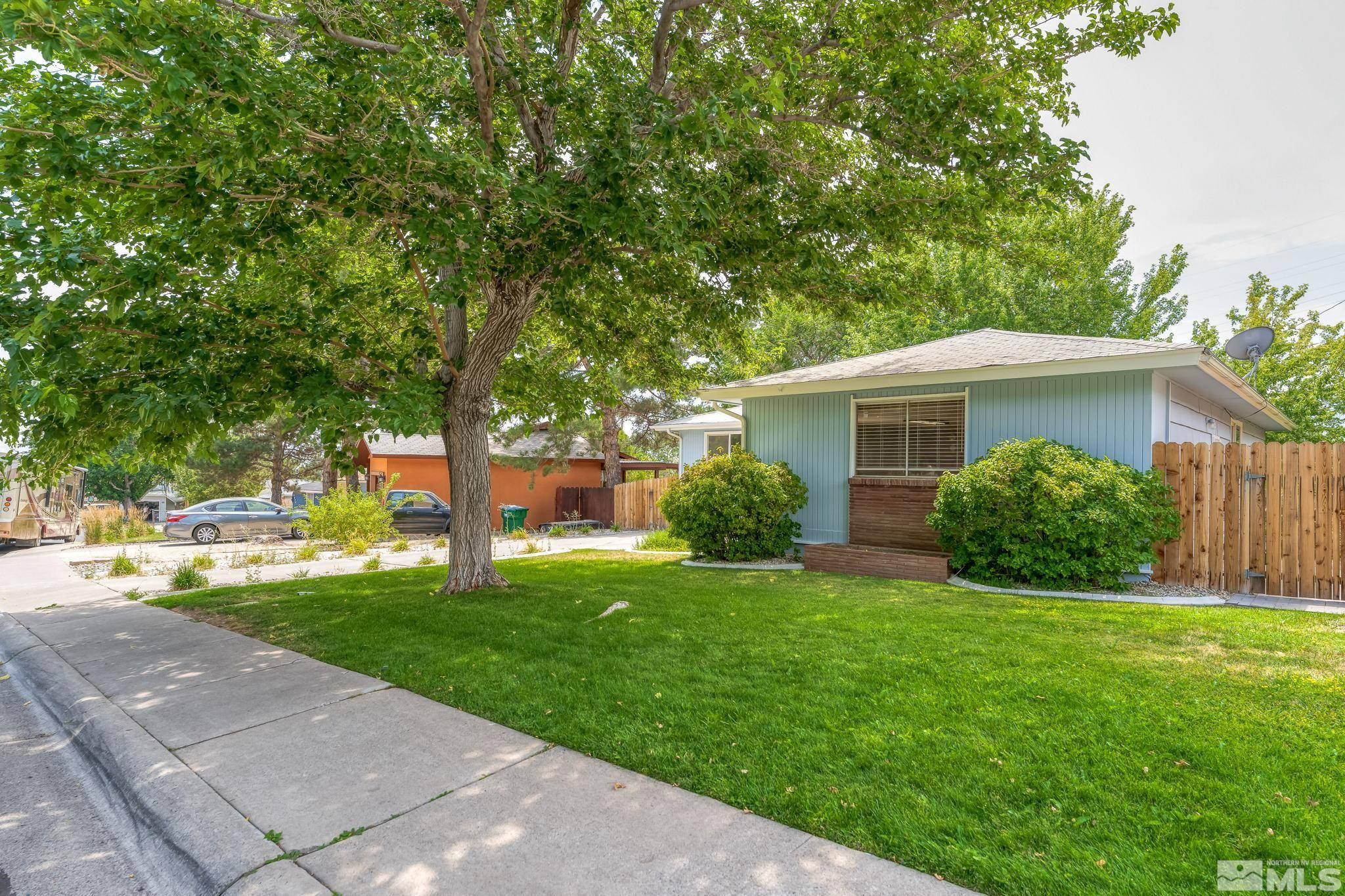 2710 Apollo Way Reno, NV 89503 - Photo 3 of 32 a view of a house with a yard and a garden