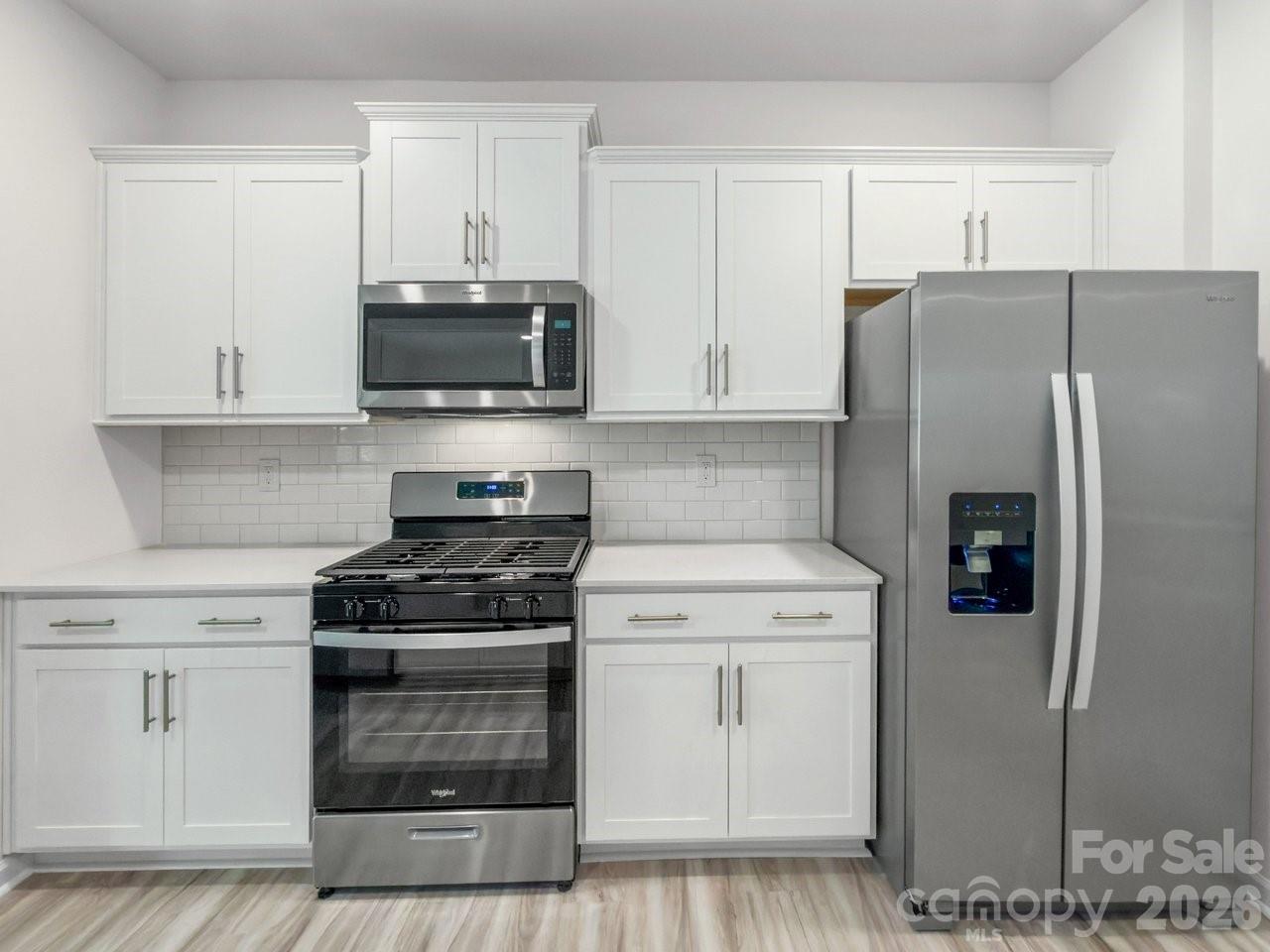 3688 Mercer Street Terrell, NC 28682 - Photo 10 of 34 a kitchen with a stove and a refrigerator