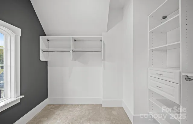 a view of an empty walk in closet