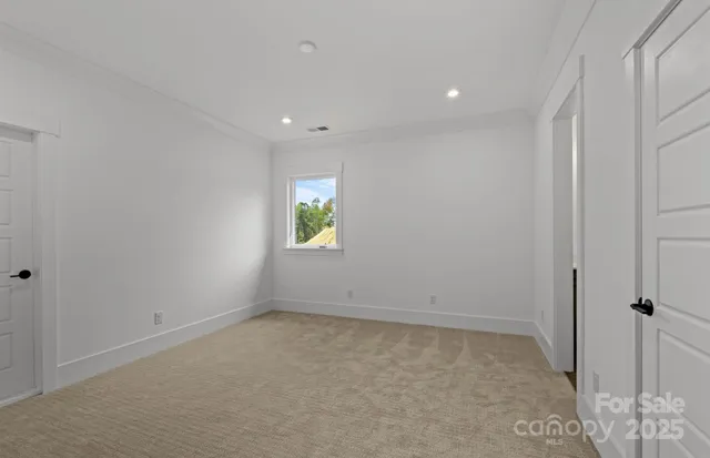 an empty room with a empty space and window