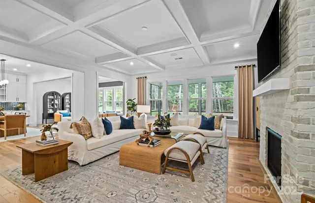 a living room with furniture fireplace and a flat screen tv