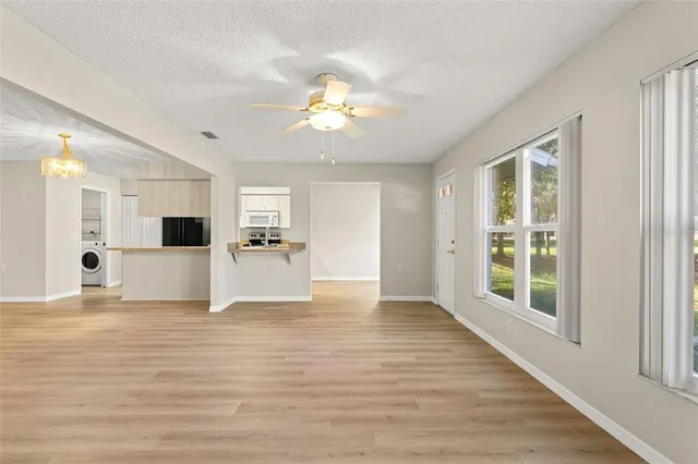 a view of a kitchen with a sink and a window