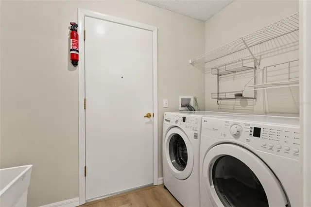 a view of entryway with washer and dryer