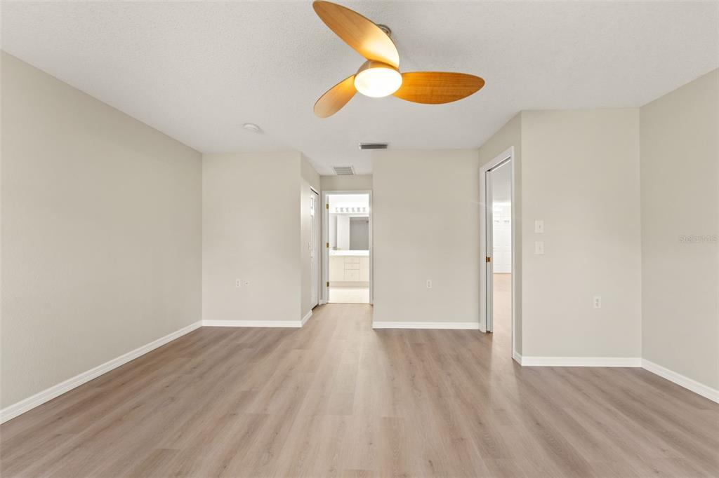 1415 Pinewood Hills Court Spring Hill, FL 34606 - Photo 22 of 45 a view of an empty room and wooden floor