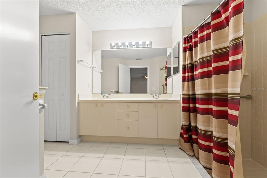 1415 Pinewood Hills Court Spring Hill, FL 34606 - Photo 25 of 45 a bathroom with a sink and a mirror