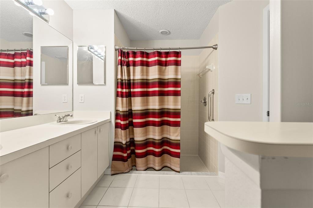 1415 Pinewood Hills Court Spring Hill, FL 34606 - Photo 26 of 45 a bathroom with a sink toilet and shower