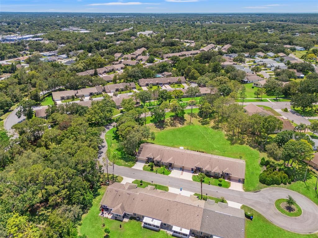 1415 Pinewood Hills Court Spring Hill, FL 34606 - Photo 33 of 45 an aerial view of a city with lots of residential buildings