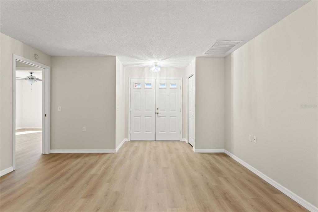 1415 Pinewood Hills Court Spring Hill, FL 34606 - Photo 7 of 45 wooden floor in an empty room