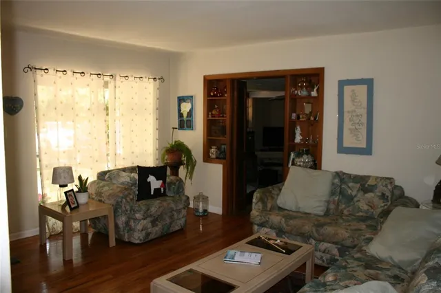 a living room with furniture and a window