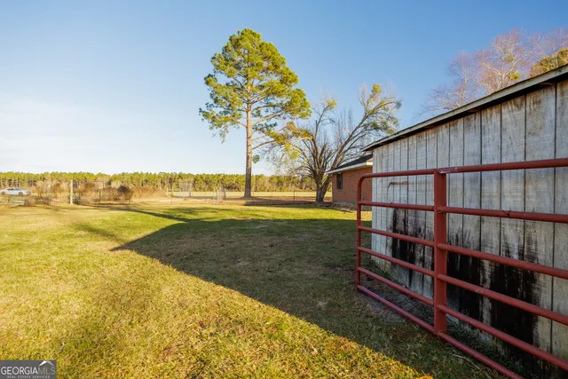 a view of a swimming pool with a lounge chair