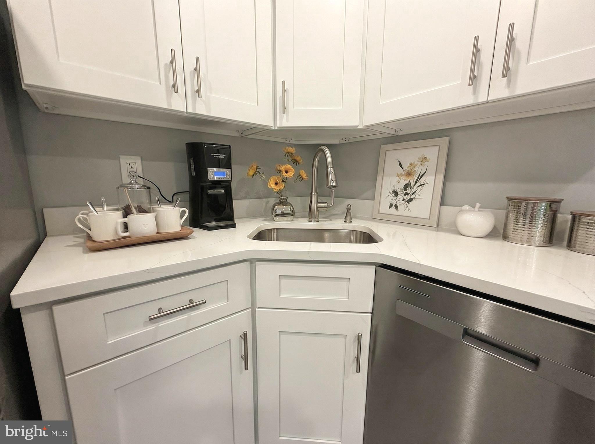 205 Castleton Court Pennington, NJ 08534 - Photo 11 of 26 a kitchen with a sink and cabinets