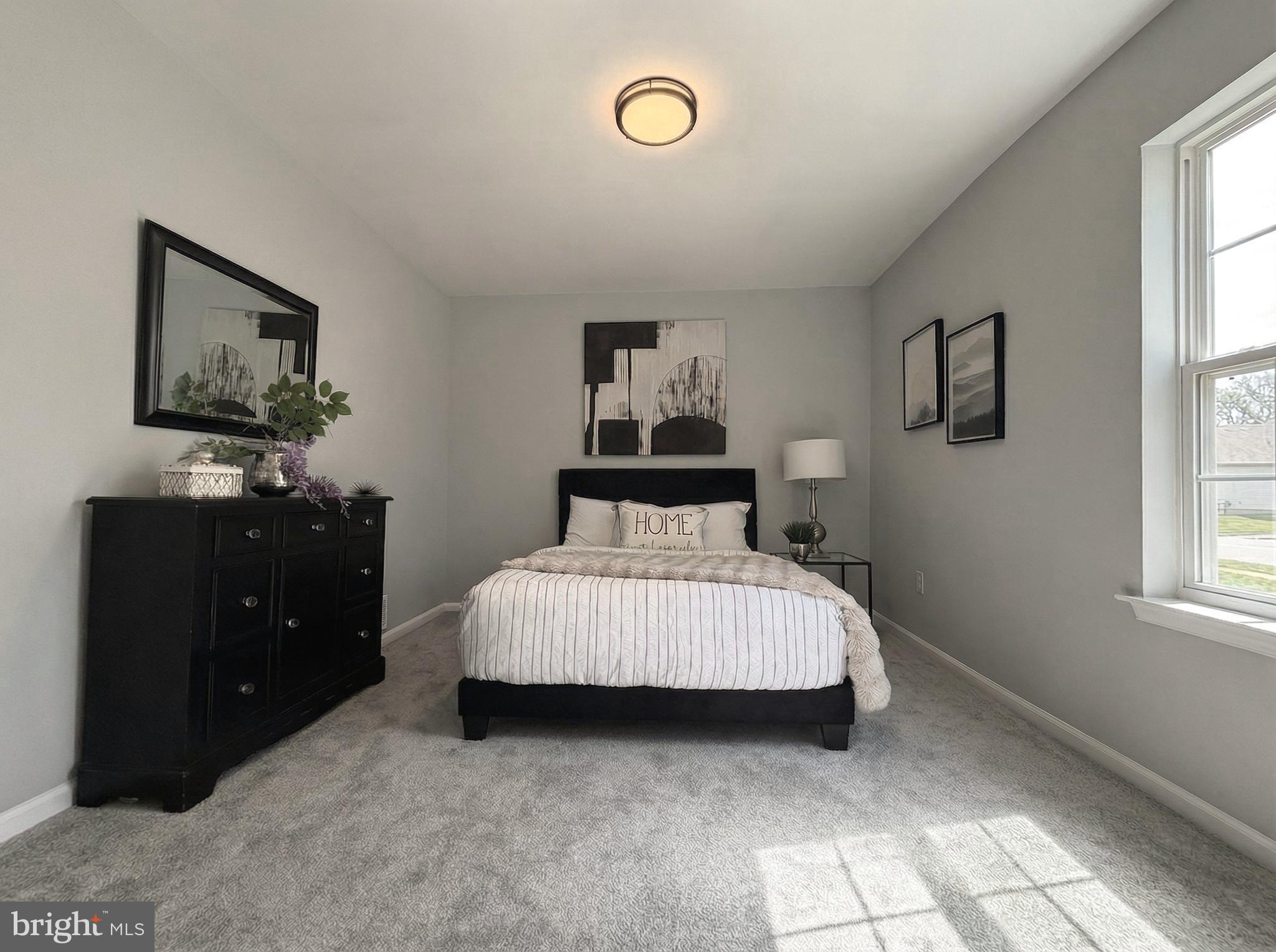 205 Castleton Court Pennington, NJ 08534 - Photo 15 of 26 a bedroom with a bed and a window