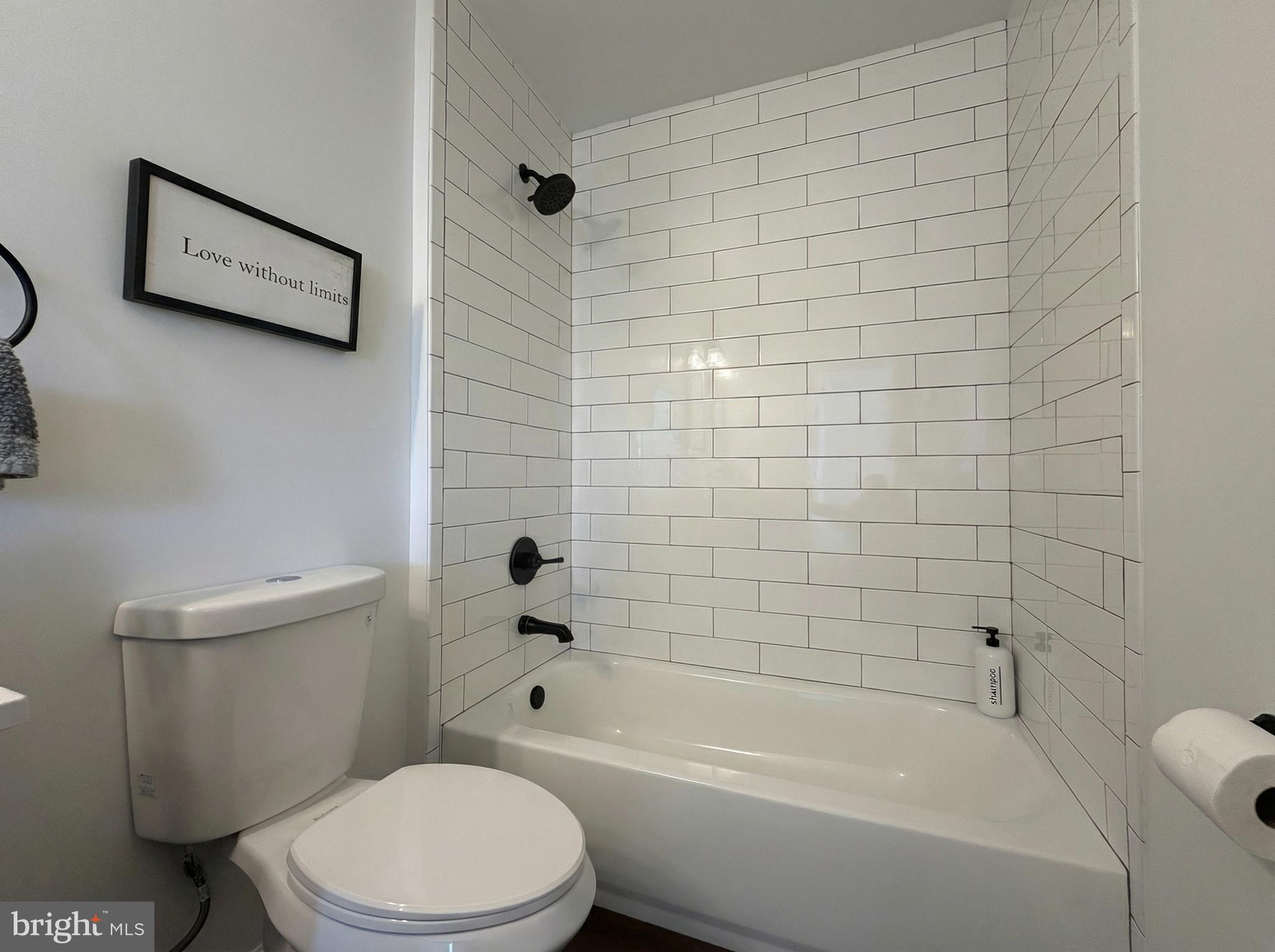 205 Castleton Court Pennington, NJ 08534 - Photo 18 of 26 a white toilet and tub sitting next to a bathroom sink
