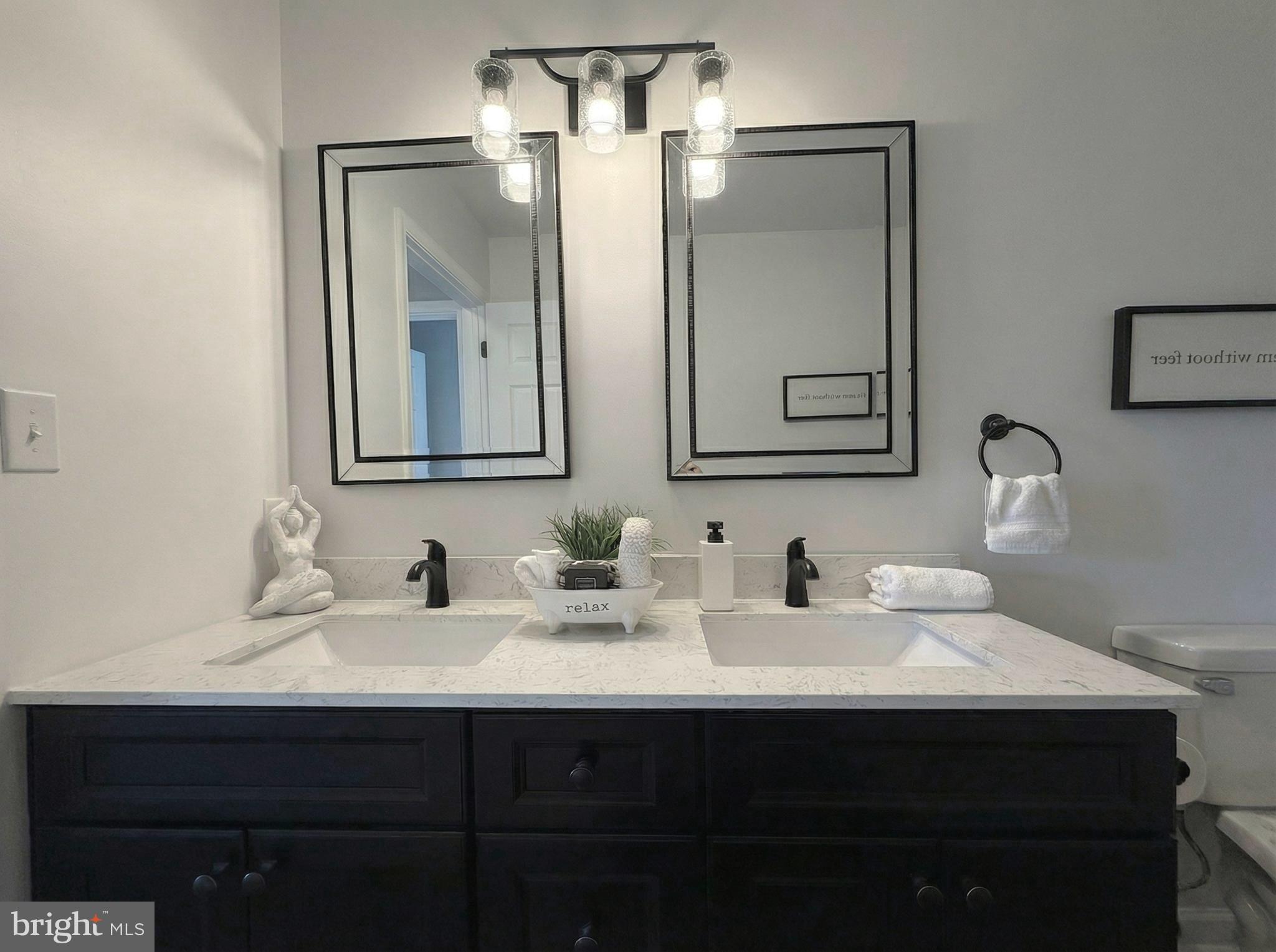 205 Castleton Court Pennington, NJ 08534 - Photo 19 of 26 a bathroom with double sink and two mirror