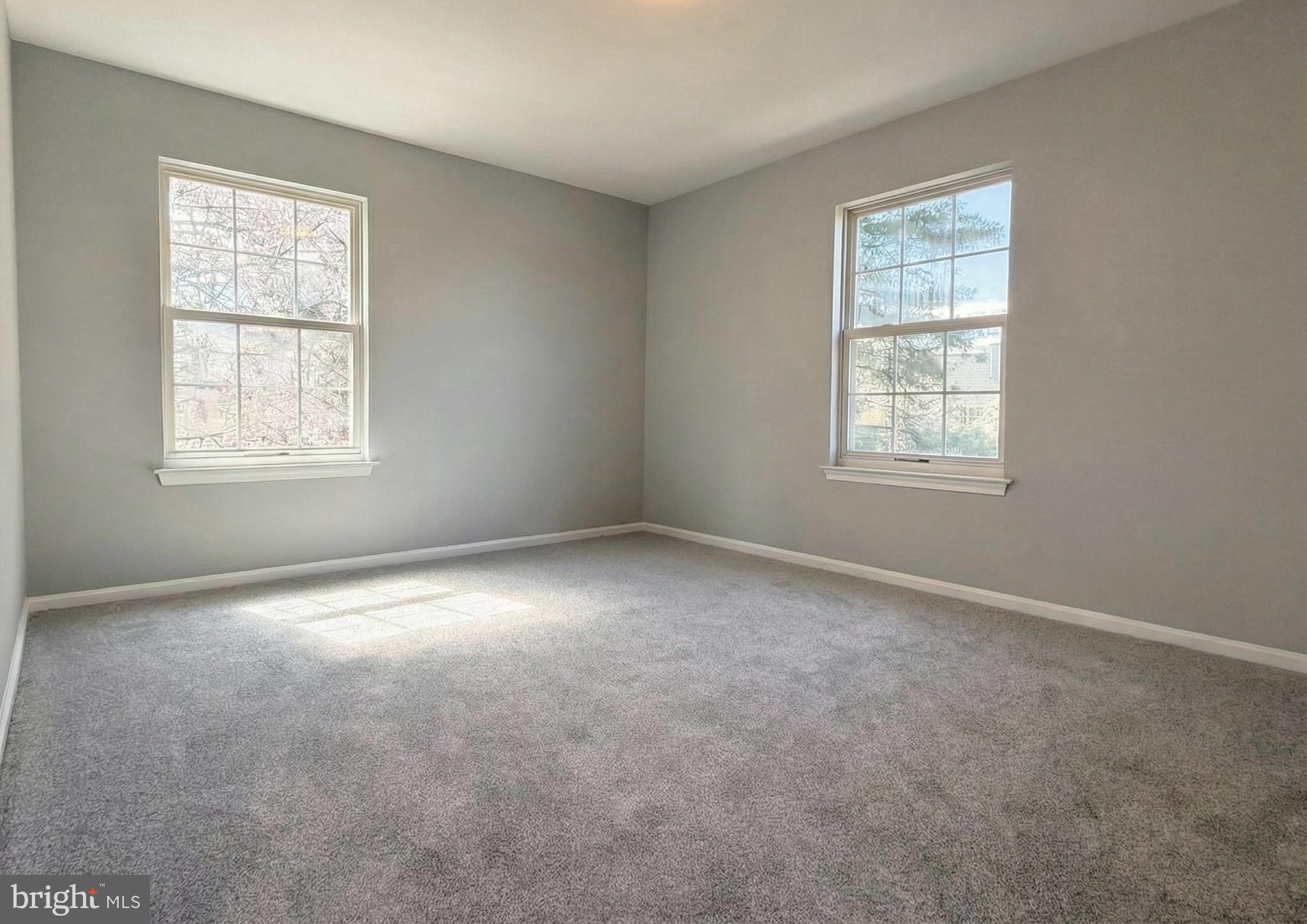 205 Castleton Court Pennington, NJ 08534 - Photo 20 of 26 an empty room with windows