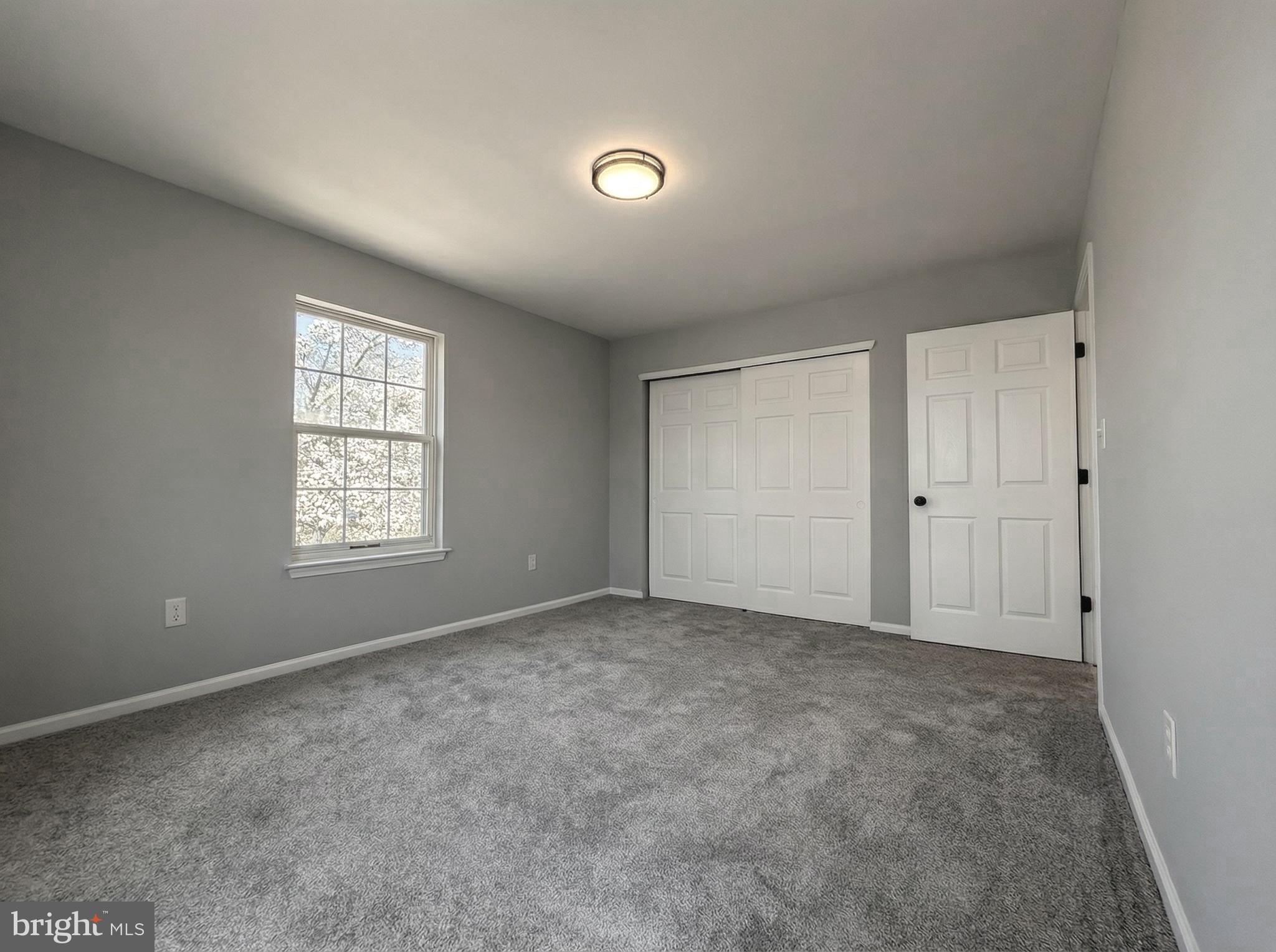 205 Castleton Court Pennington, NJ 08534 - Photo 21 of 26 an empty room with windows