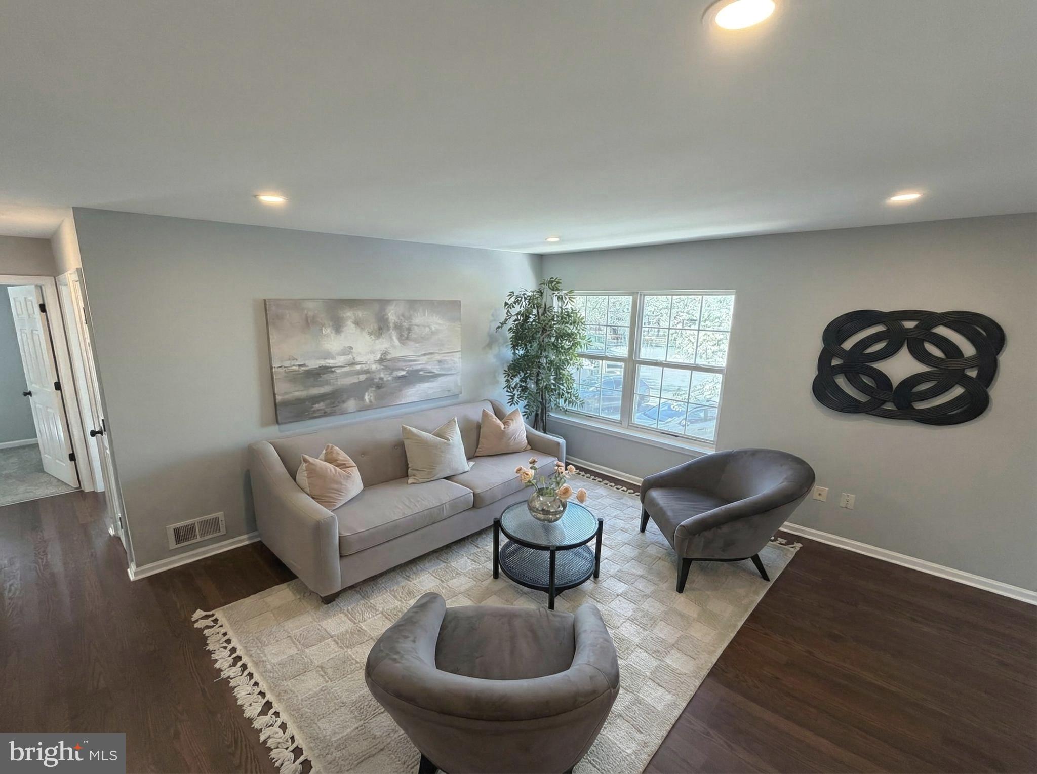 205 Castleton Court Pennington, NJ 08534 - Photo 3 of 26 a living room with furniture and a large window