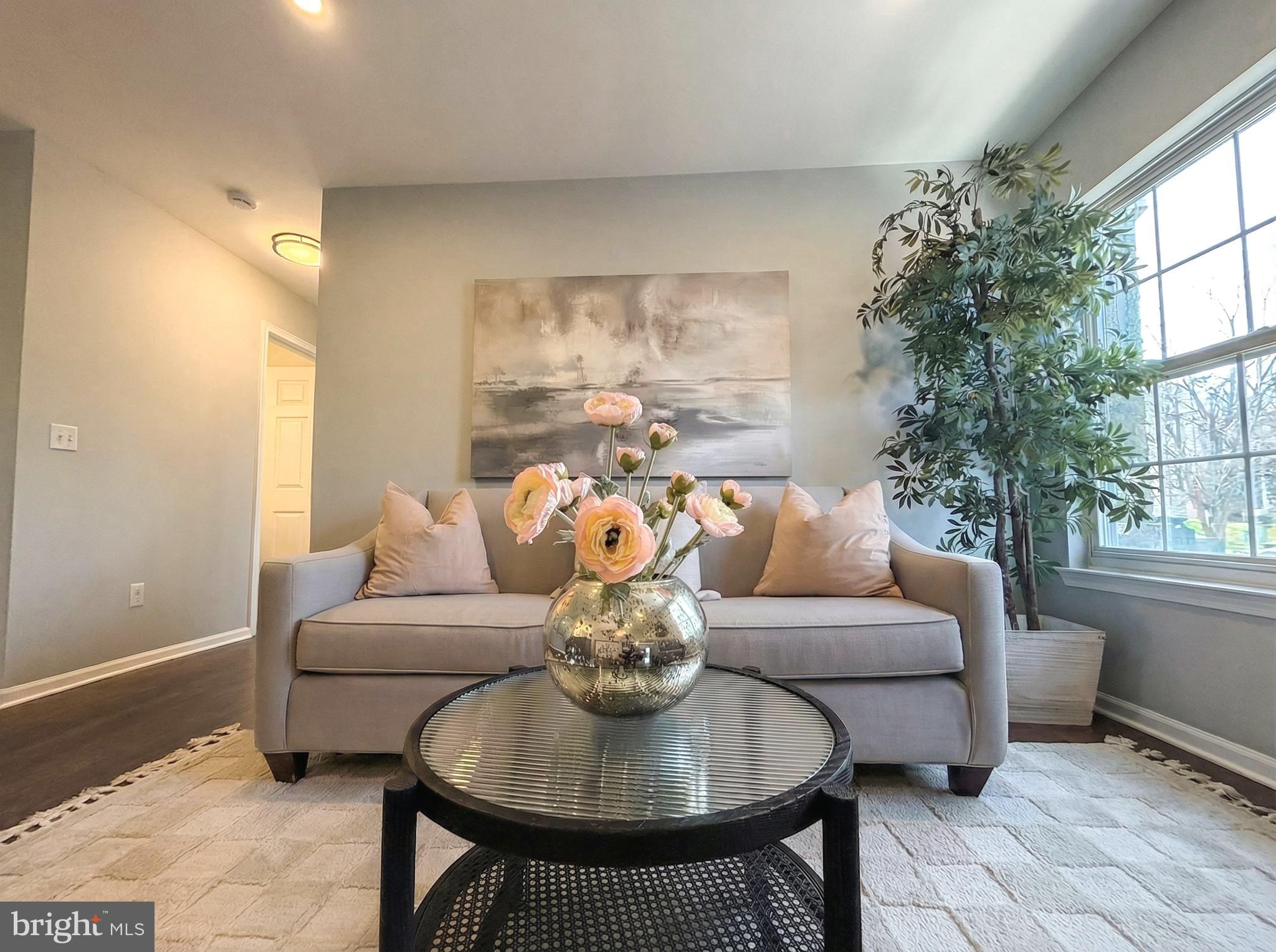 205 Castleton Court Pennington, NJ 08534 - Photo 4 of 26 a living room with furniture and a large window