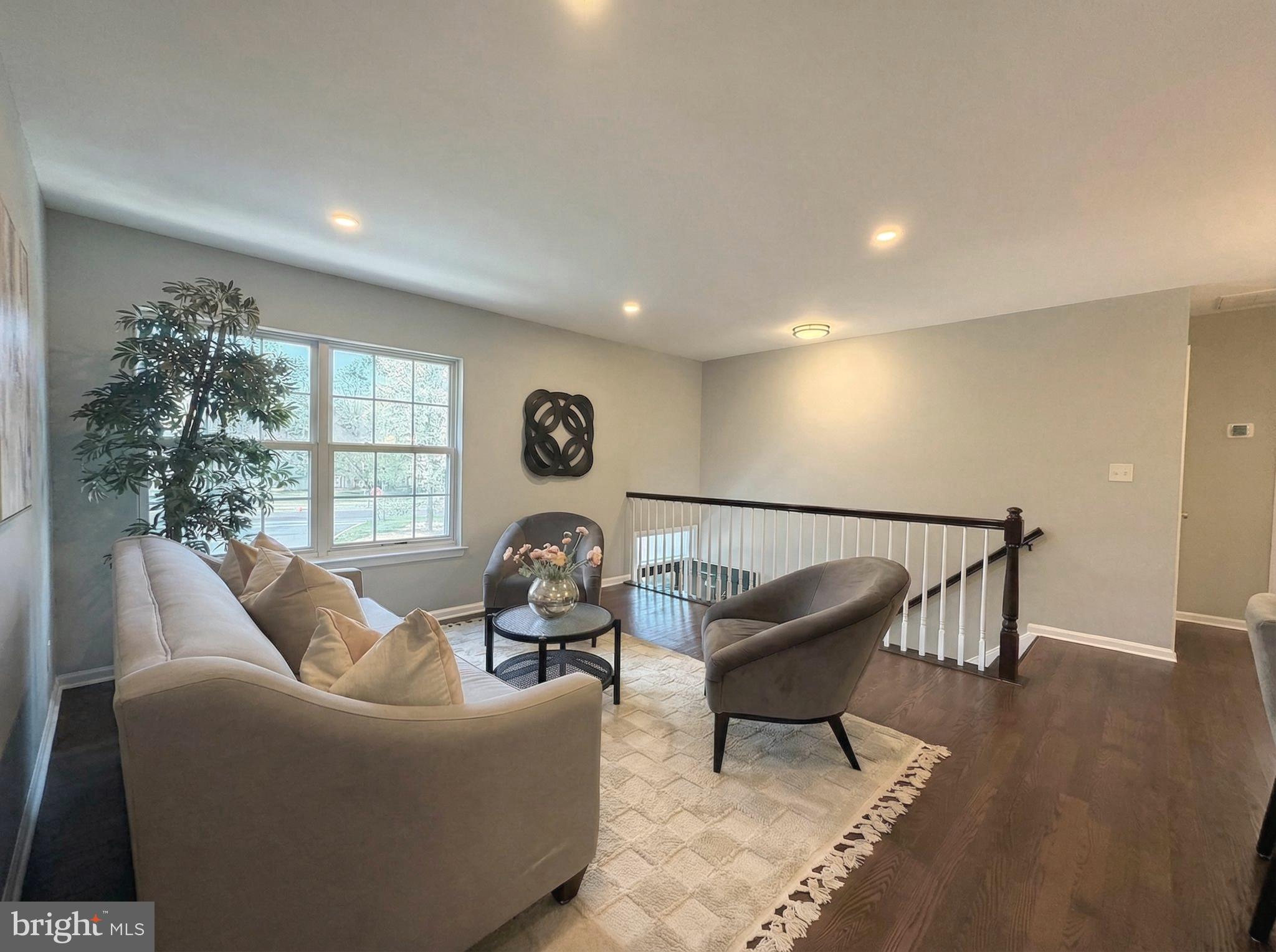 205 Castleton Court Pennington, NJ 08534 - Photo 5 of 26 a living room with furniture and a window
