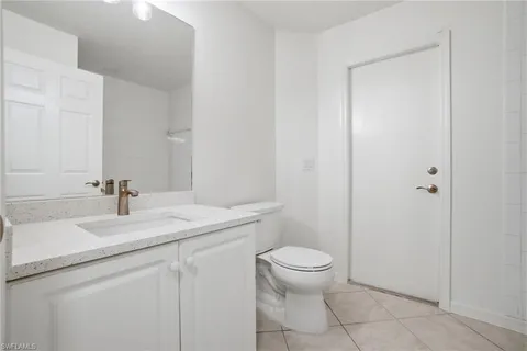 a bathroom with a sink toilet and vanity