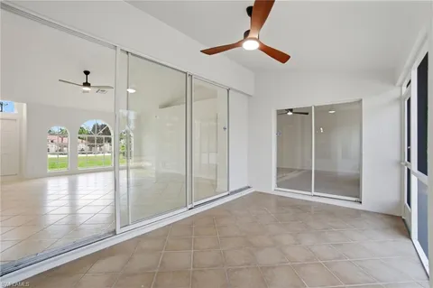 a view of an empty room and a window