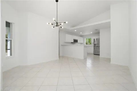 a view of a kitchen with a sink and a kitchen counter top space