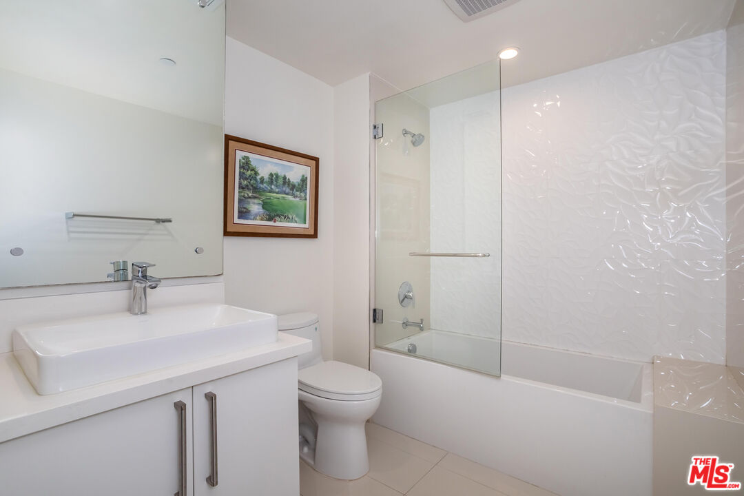 11764 Idaho Avenue, Unit 301 Los Angeles, CA 90025 - Photo 12 of 20 a bathroom with a sink a toilet and shower