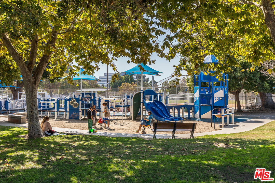 11764 Idaho Avenue, Unit 301 Los Angeles, CA 90025 - Photo 17 of 20 a swimming pool with outdoor seating and yard
