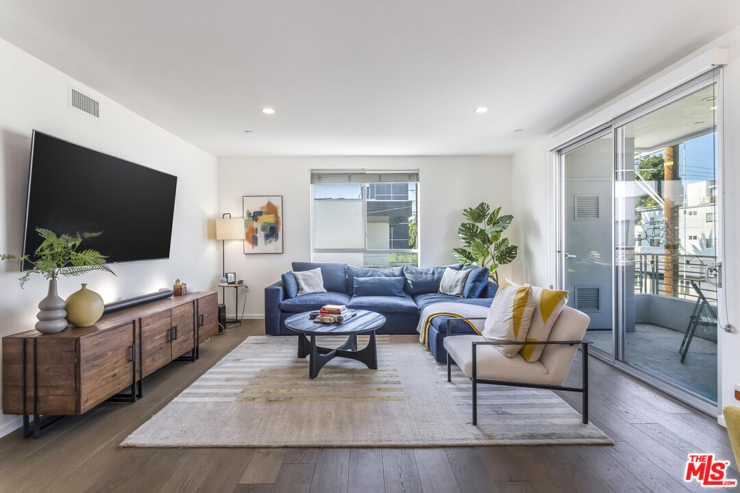 11764 Idaho Avenue, Unit 301 Los Angeles, CA 90025 - Photo 6 of 20 a living room with furniture and a flat screen tv