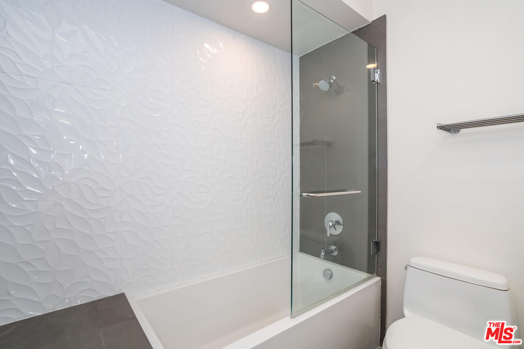11764 Idaho Avenue, Unit 301 Los Angeles, CA 90025 - Photo 10 of 20 a bathroom with a bathtub and a shower