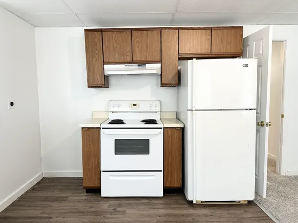 a white refrigerator freezer sitting in a kitchen