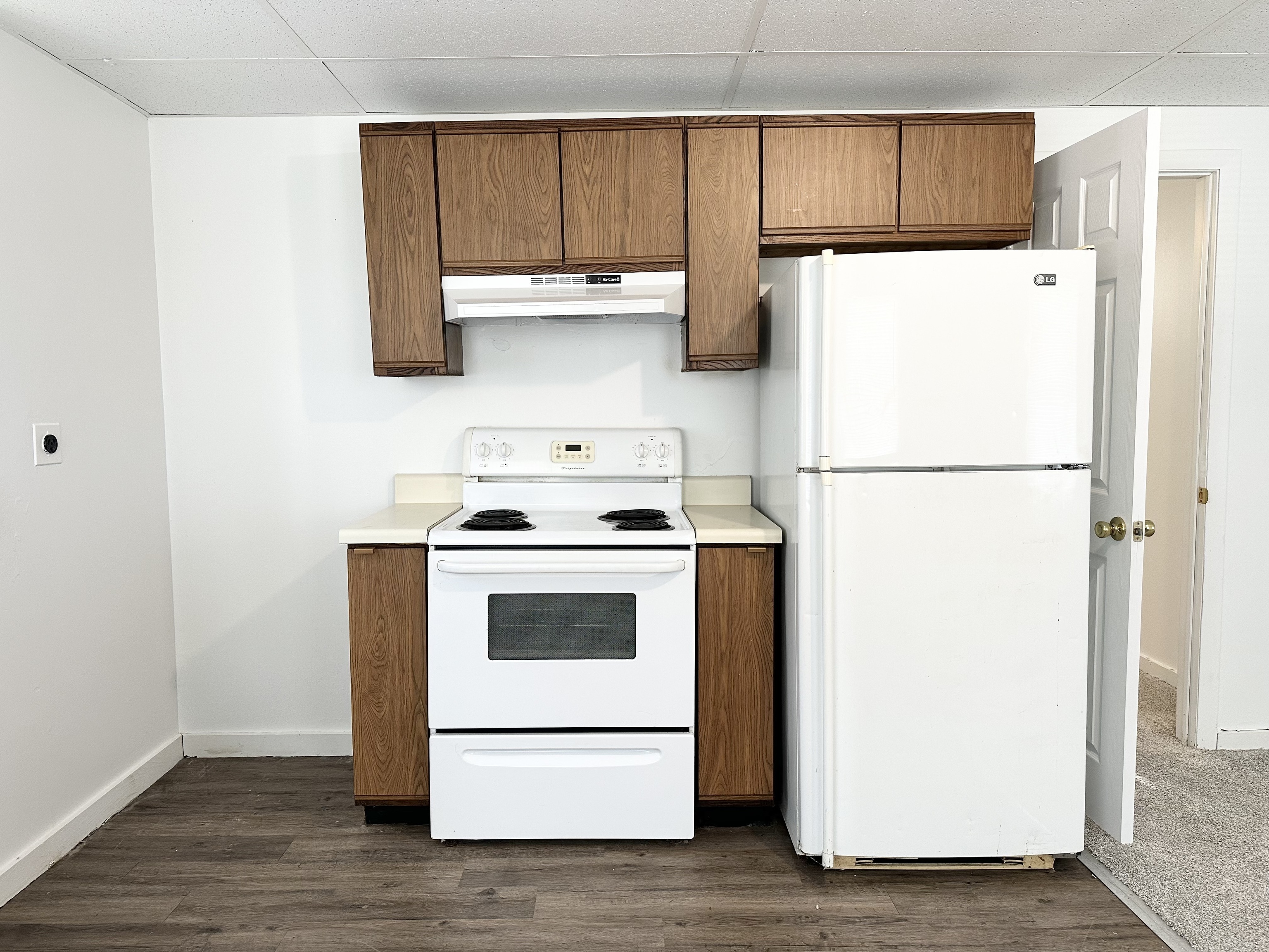 123 High Street Sprague, CT 06330 - Photo 5 of 11 a white refrigerator freezer sitting in a kitchen