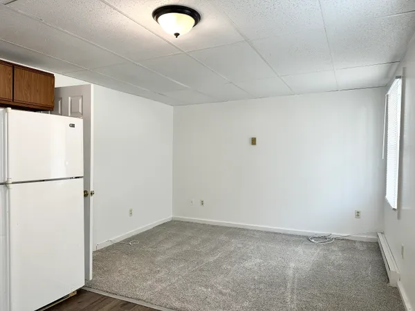 a view of a refrigerator in a kitchen