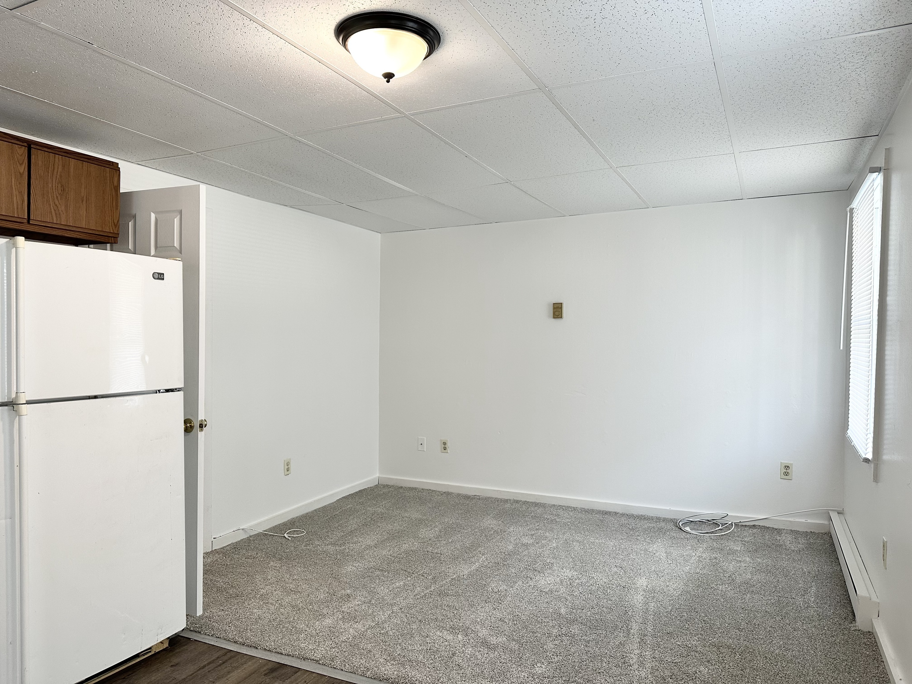 123 High Street Sprague, CT 06330 - Photo 6 of 11 a view of a refrigerator in a kitchen