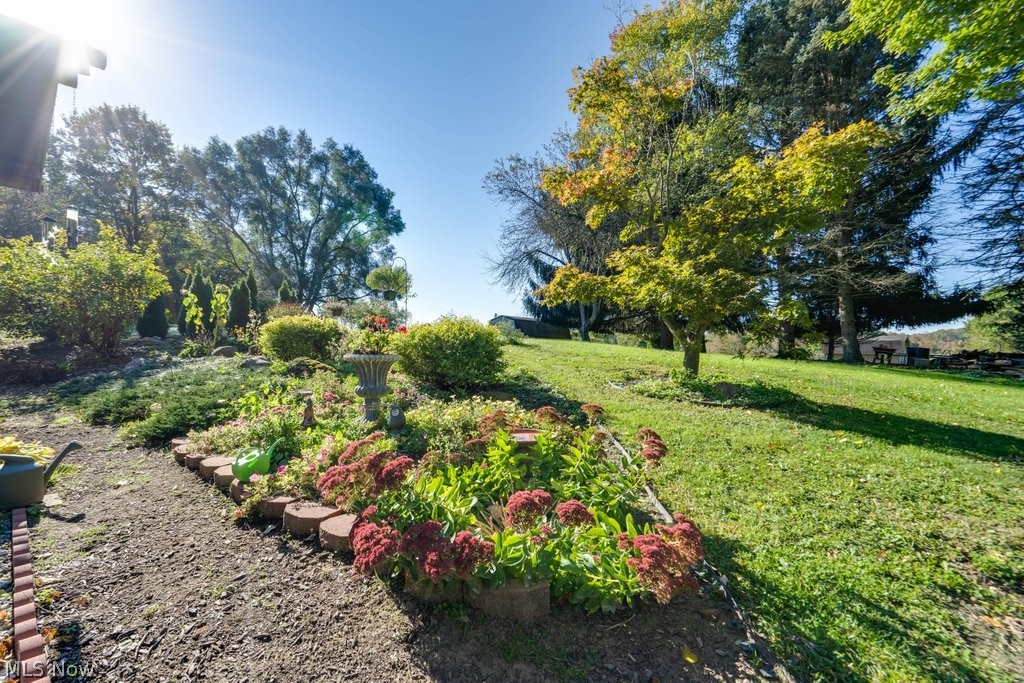 2601 Ranfield Road Mogadore, OH 44260 - Photo 20 of 26 perennial plantings in the backyard