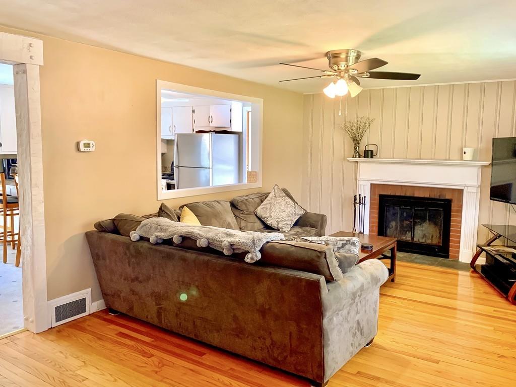 411 Dwight Road East Longmeadow, MA 01028 - Photo 12 of 34 a living room with furniture and a fireplace