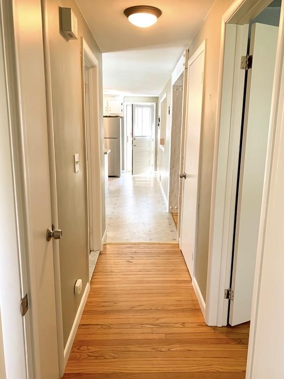 411 Dwight Road East Longmeadow, MA 01028 - Photo 13 of 34 a view of a hallway with wooden floor and staircase