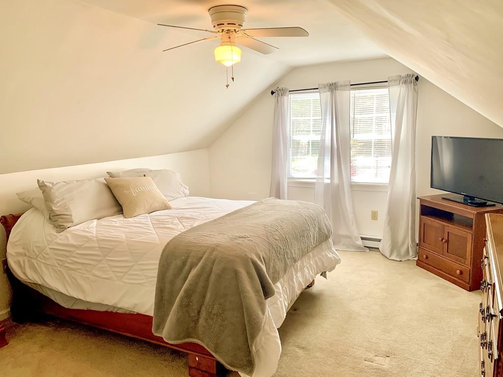411 Dwight Road East Longmeadow, MA 01028 - Photo 20 of 34 a bedroom with a bed and a flat screen tv
